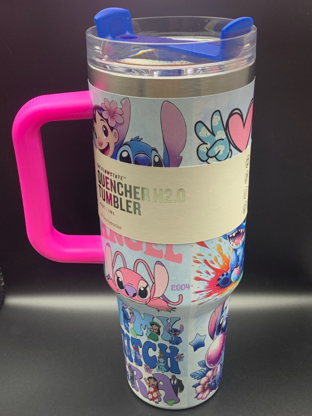 Stanley Travel Mug with Blue Lid and Bright Pink Handle Featuring Stitch Artwork